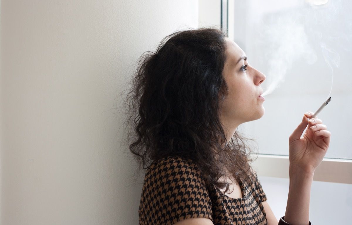 Black haired woman having smoking