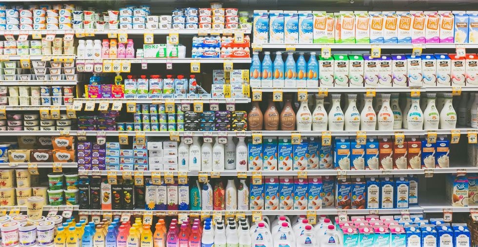 a grocery aisle of dairy products