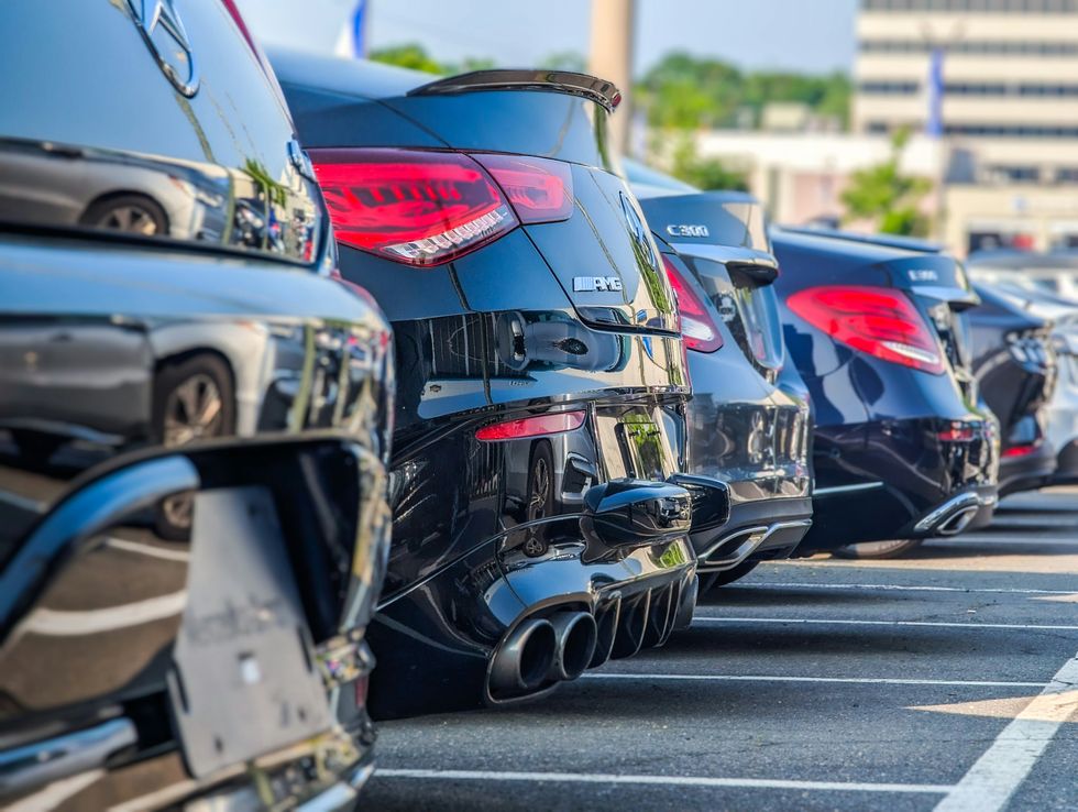 a series of cars in a parking lot