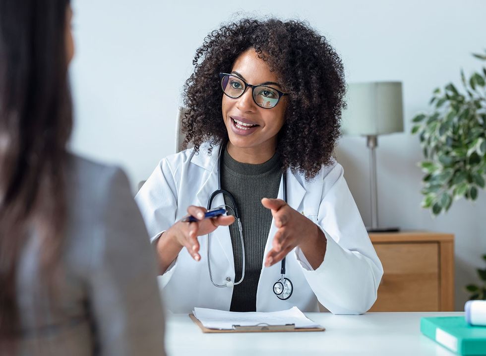 A woman doctor talking to her patient