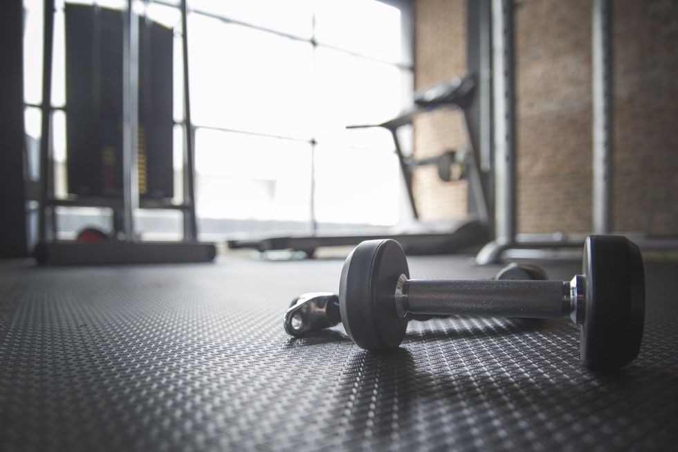 dumbell and rope on gym floor