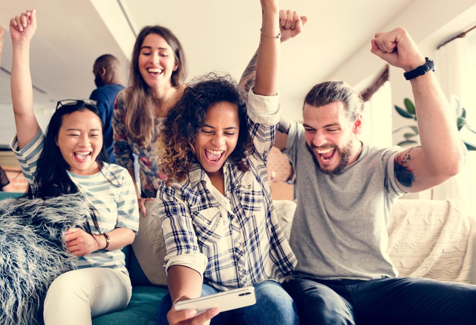 group of friends enjoying a game night with family feud questions