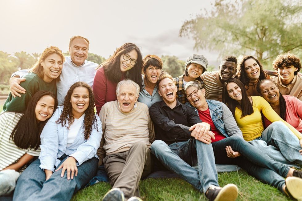 Group of friends of different ages taking a photo together