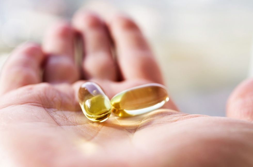 holding fish oil supplement