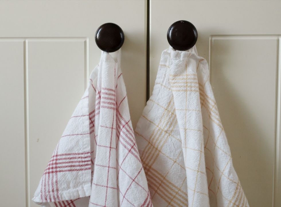 Kitchen towels hang on the button