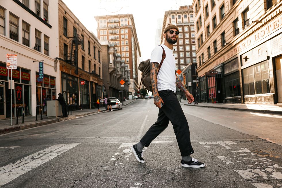 man walks on a street for daily exercise