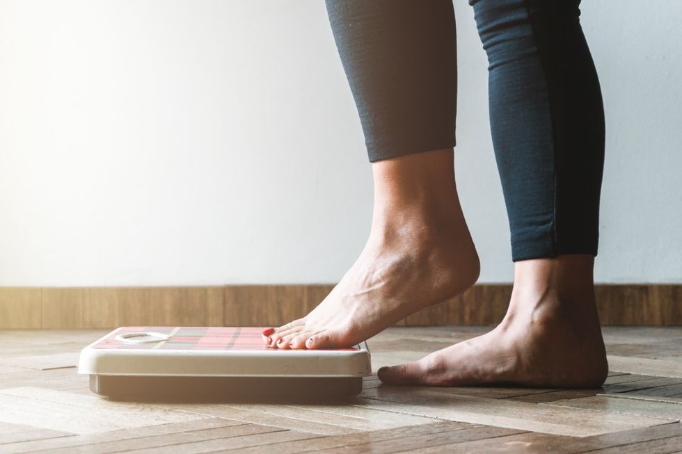 Person stepping on scale