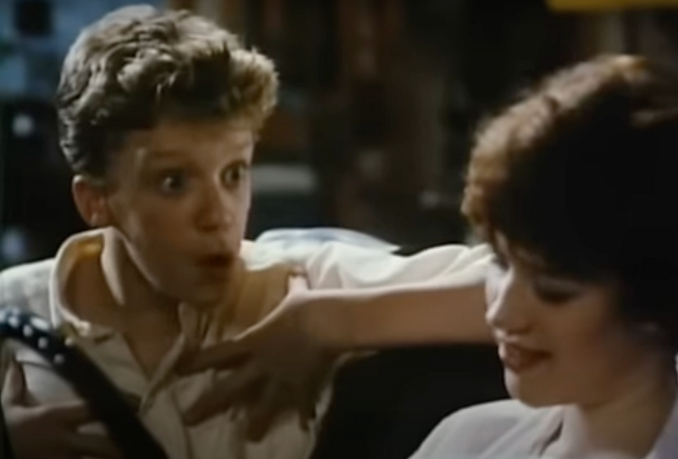 still of Anthony Michael Hall and Molly Ringwald from "Sixteen Candles"