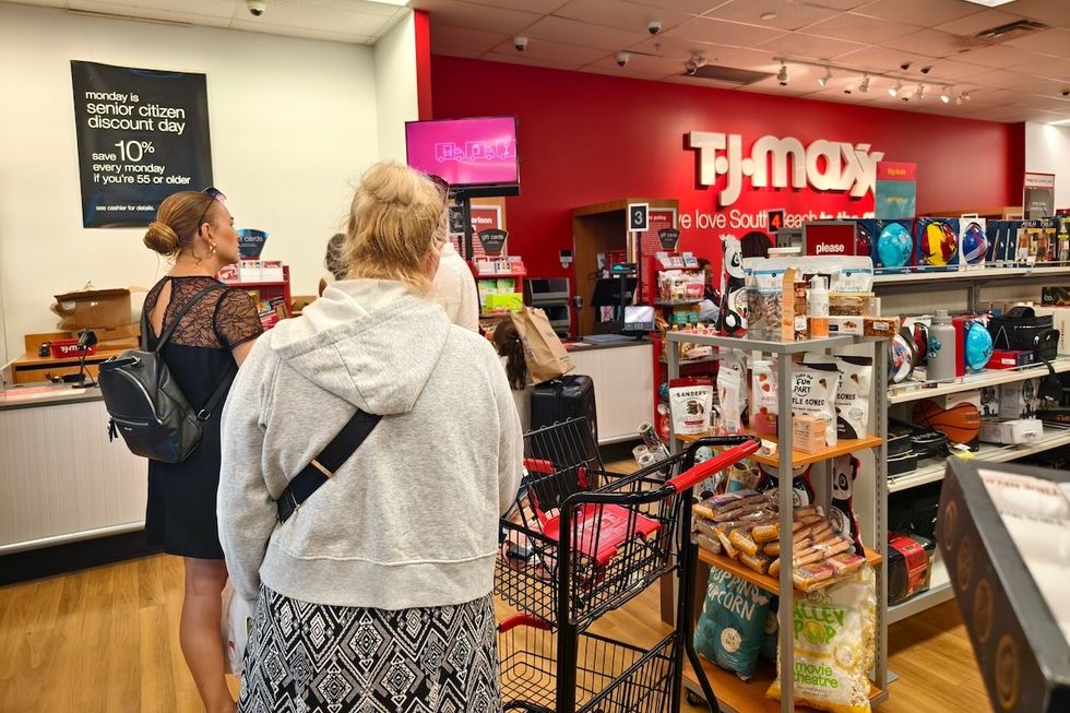 TJ Maxx shoppers waiting in line with snacks and food