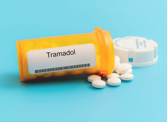 Tramadol pills on a blue background