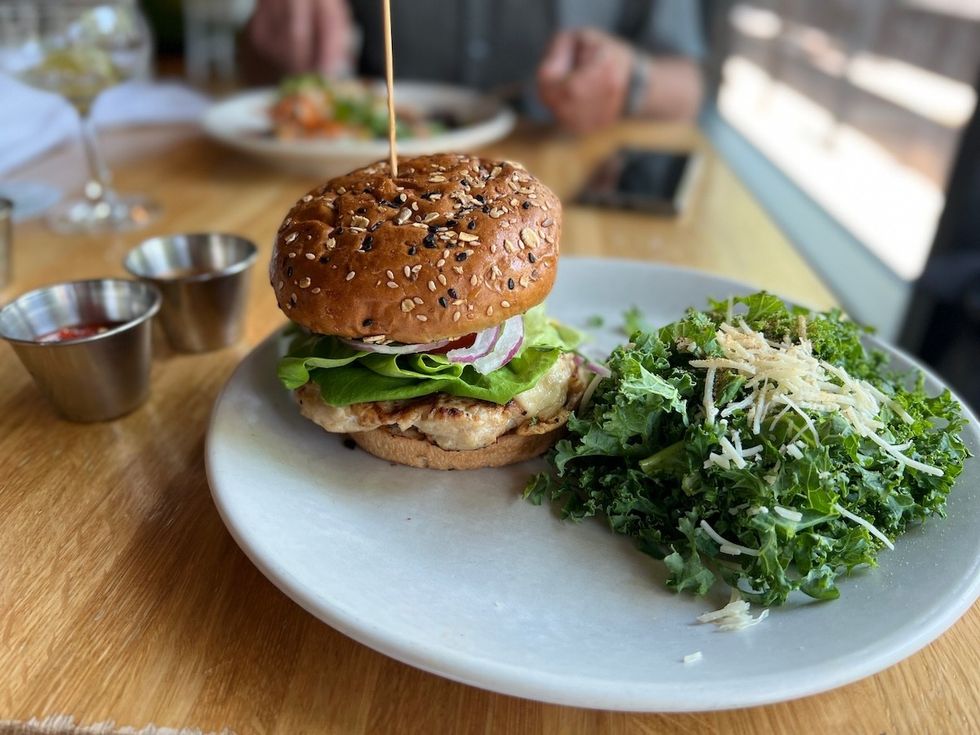 turkey burger with a side kale salad