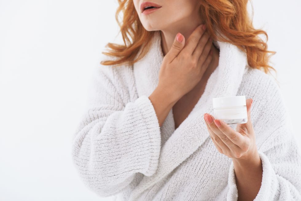 woman applying neck cream