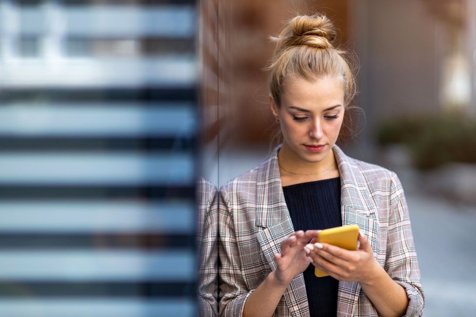 woman looking at phone