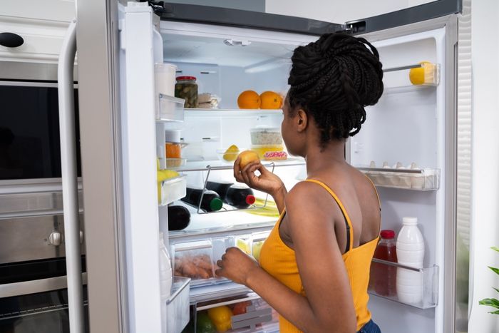 Woman looking in the fridge