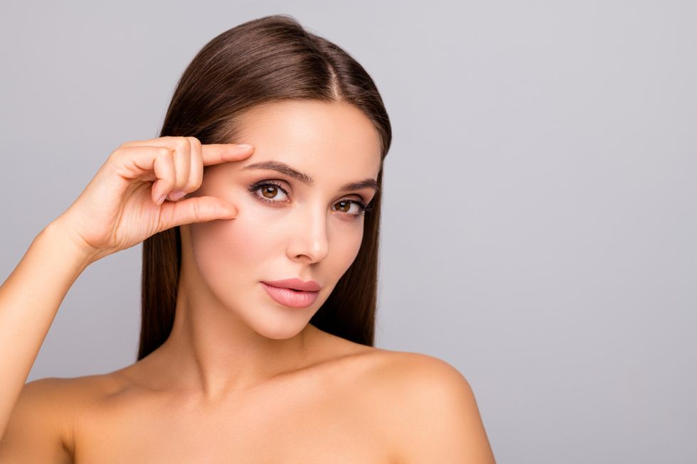 woman showing off eyebrows