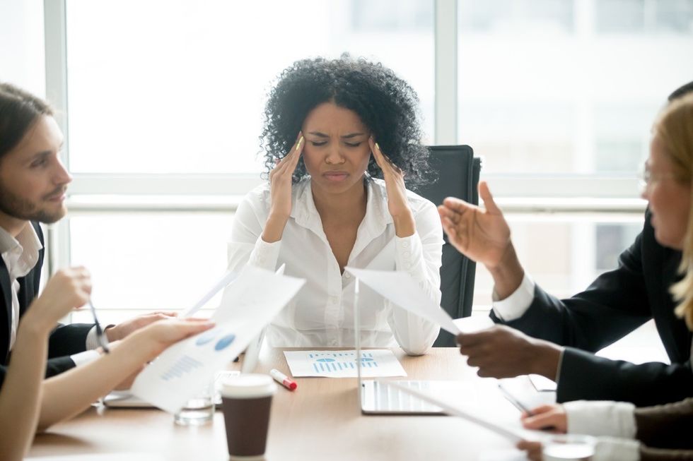 Woman stressed at her desk at work