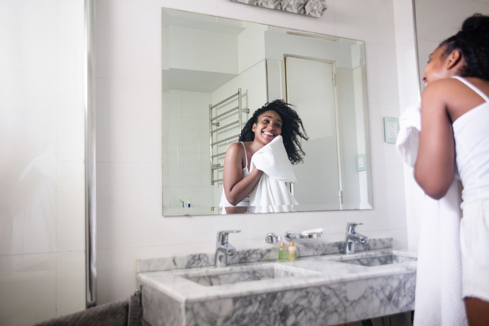 woman washing her face