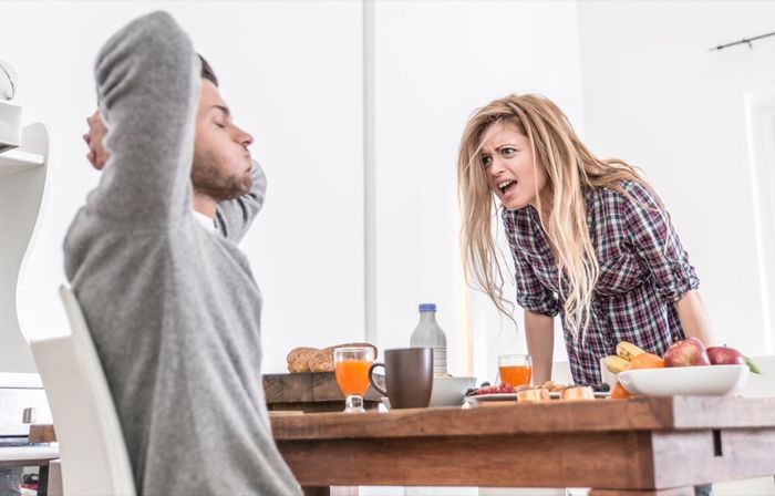 Woman yelling at her boyfriend in the kitchen