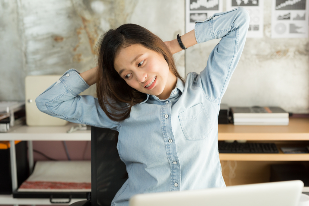 Woman Stretching in Chair at Work Workplace Stress-Busters