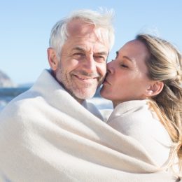 older woman kissing husband, better wife over 40