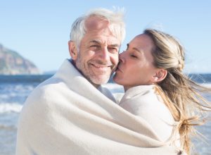 older woman kissing husband, better wife over 40