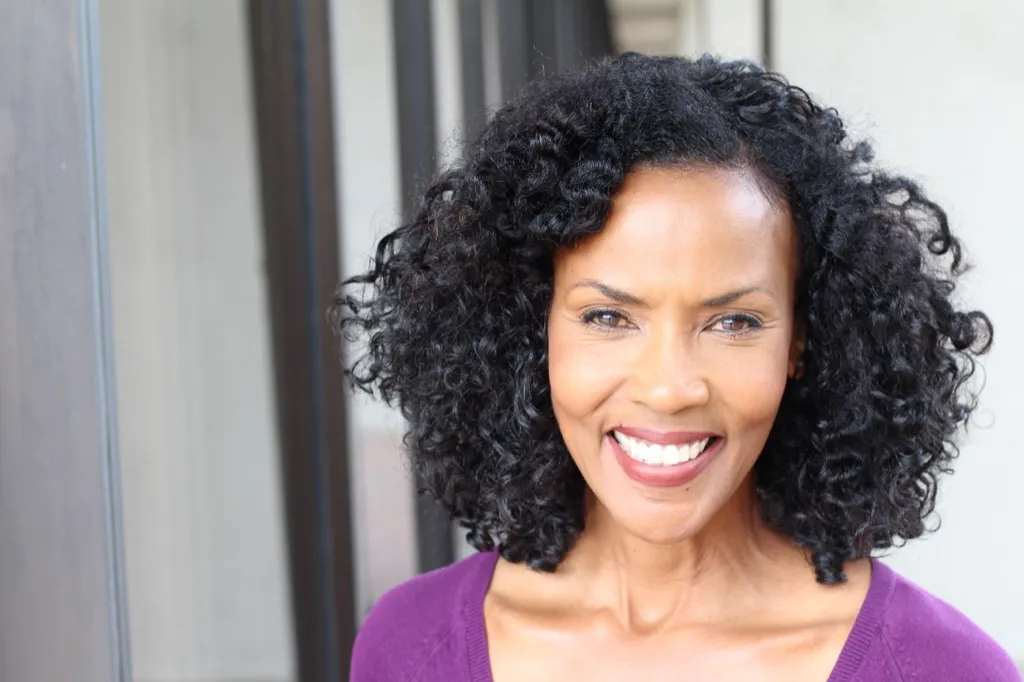 older woman smiling, white teeth, look younger 50