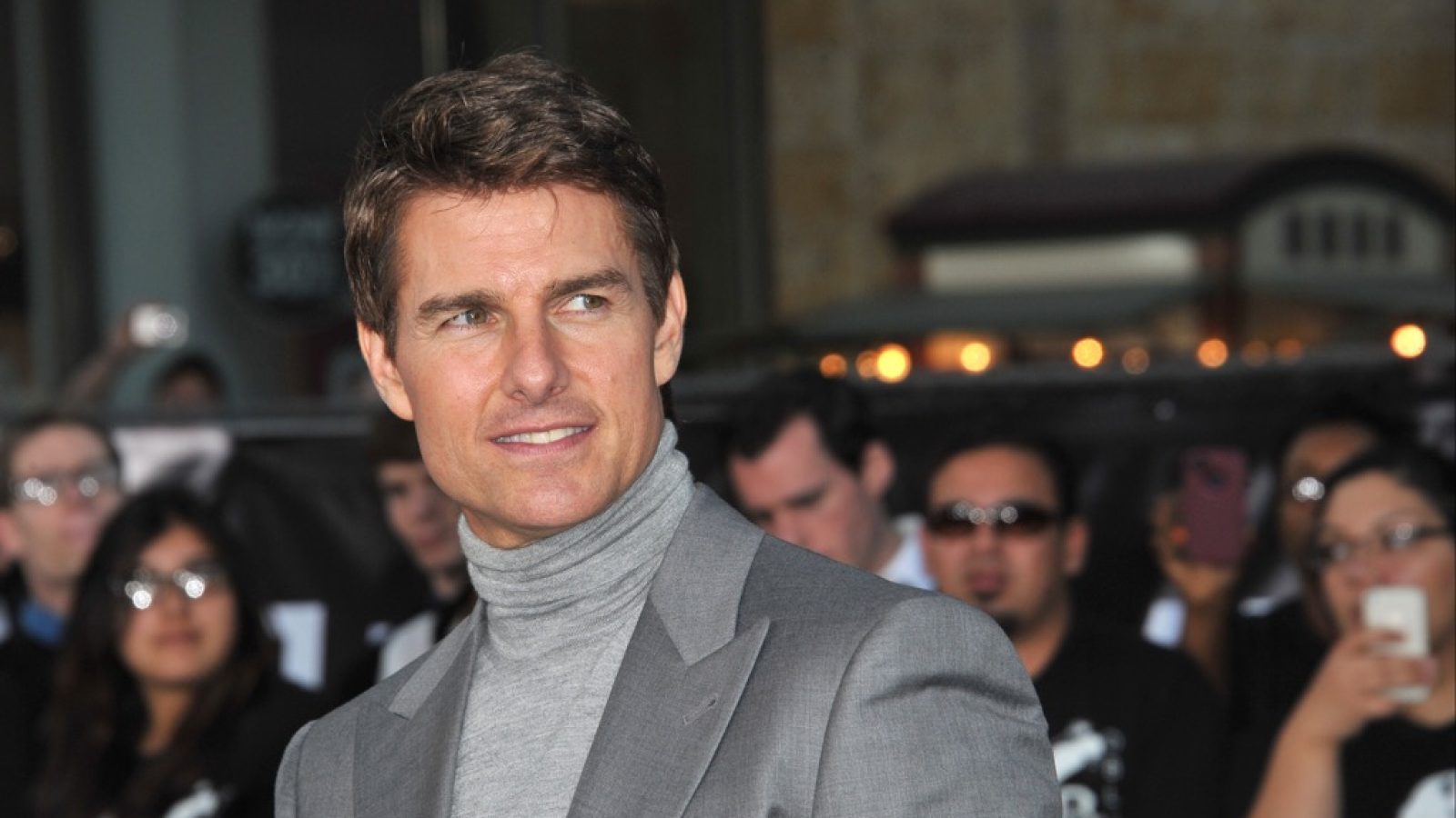 Tom Cruise in a dramatic pose, highlighting his versatility as an actor