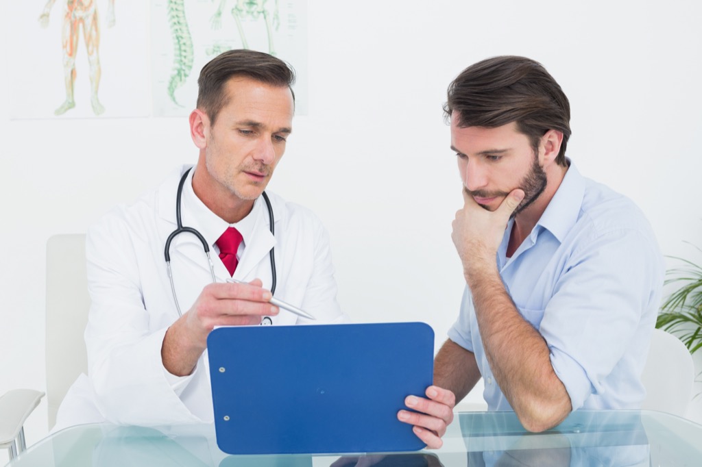 doctor and patient look at tablet, ways your body changes after 40