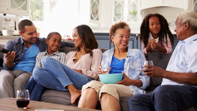 family having snacks on the couch, downsize your home