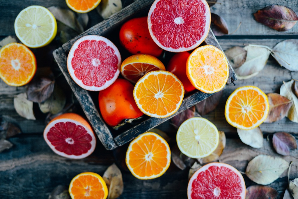 Citrus fruit, cut half ways, including grapefruit, orange, and limes