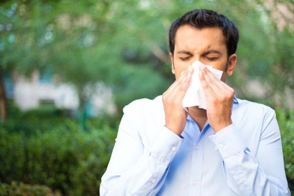 man sneezing