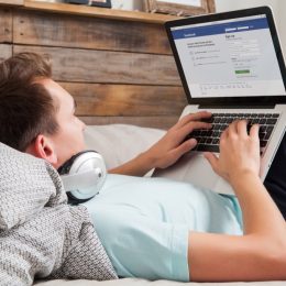 man looking at facebook
