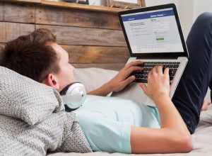 man looking at facebook