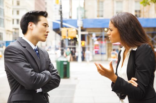 man and woman arguing outside, things you should never say to your spouse
