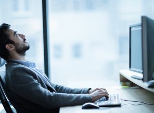 Man at his desk working from 9 to 5