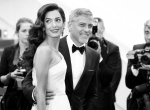 George Clooney embracing fatherhood with wife Amal.