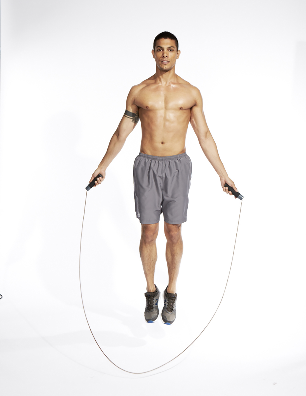 Guy jumping rope, part of a great MMA training routine. 