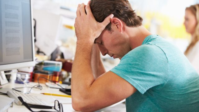 Man Stressed at Work, smart word, Everyday Energy Killers