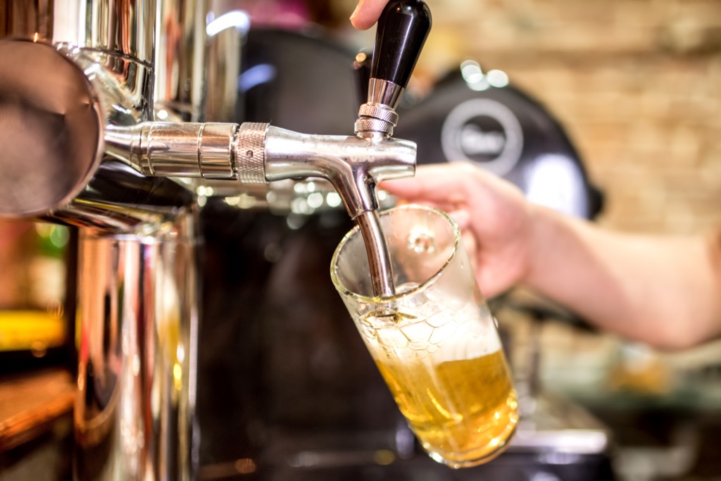 Pouring beer from tap