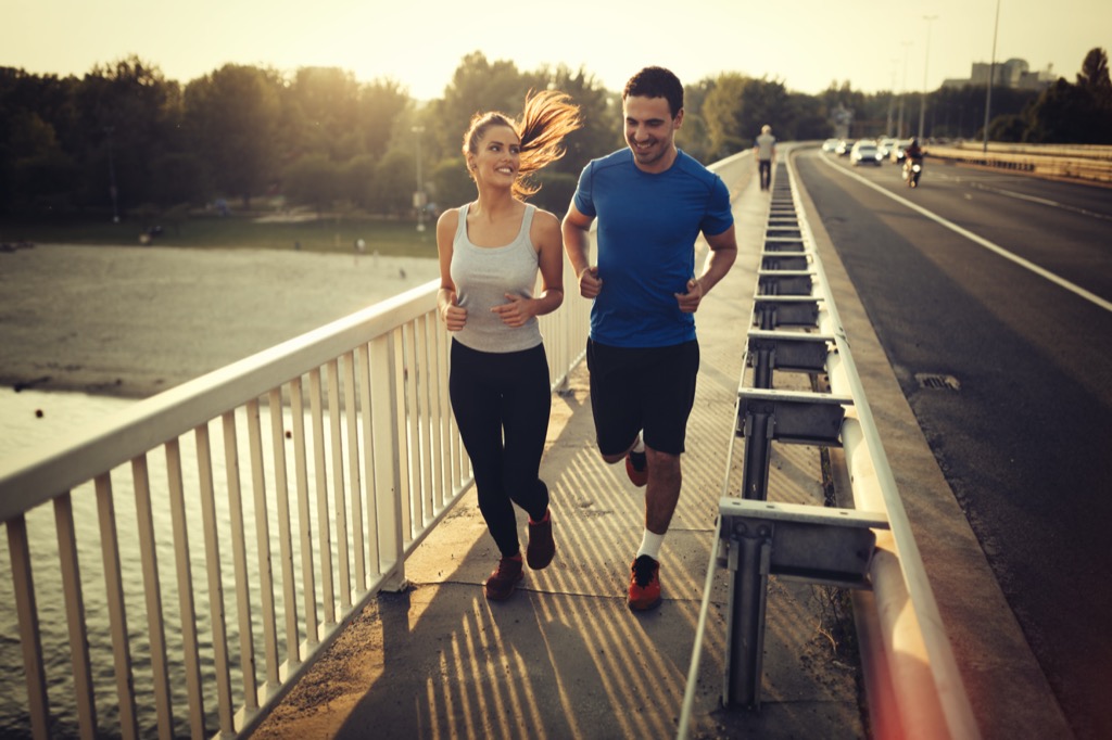 two people running outside workout