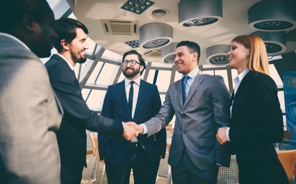 shaking hands with colleagues get richer