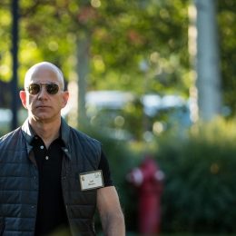 an extremely yolked jeff bezos wearing mission impossible sunglasses and a midtown uniform