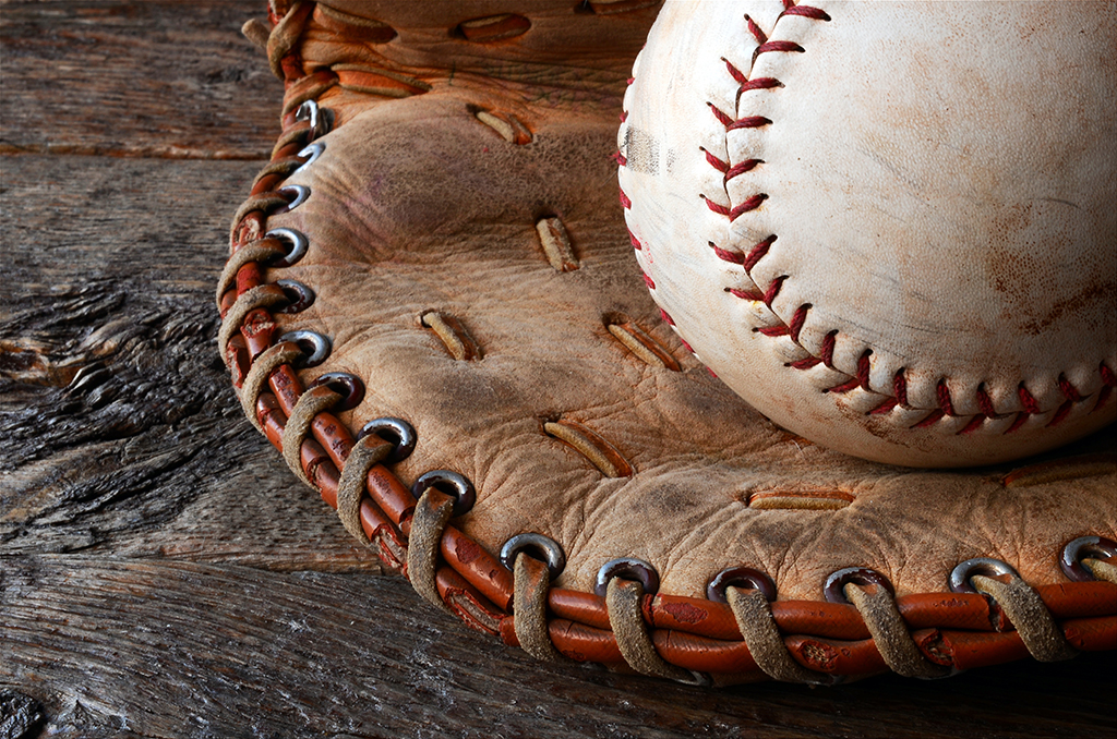 Closeup on glove and baseball