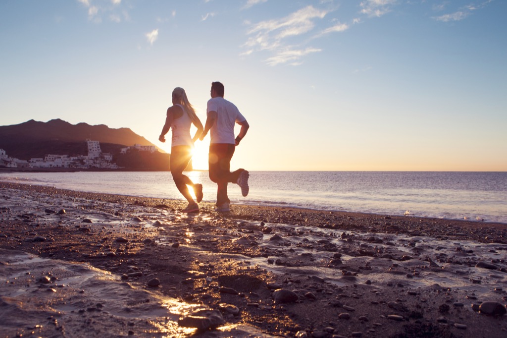 couple running on beach at sunrise, monday quotes