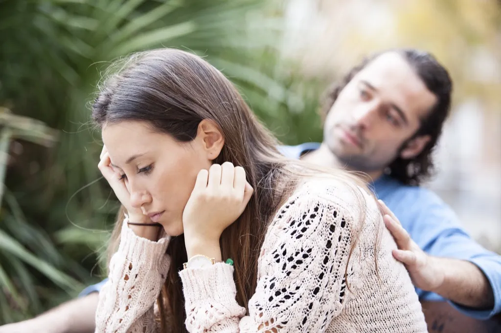 woman and man upset on park bench, things divorced people know