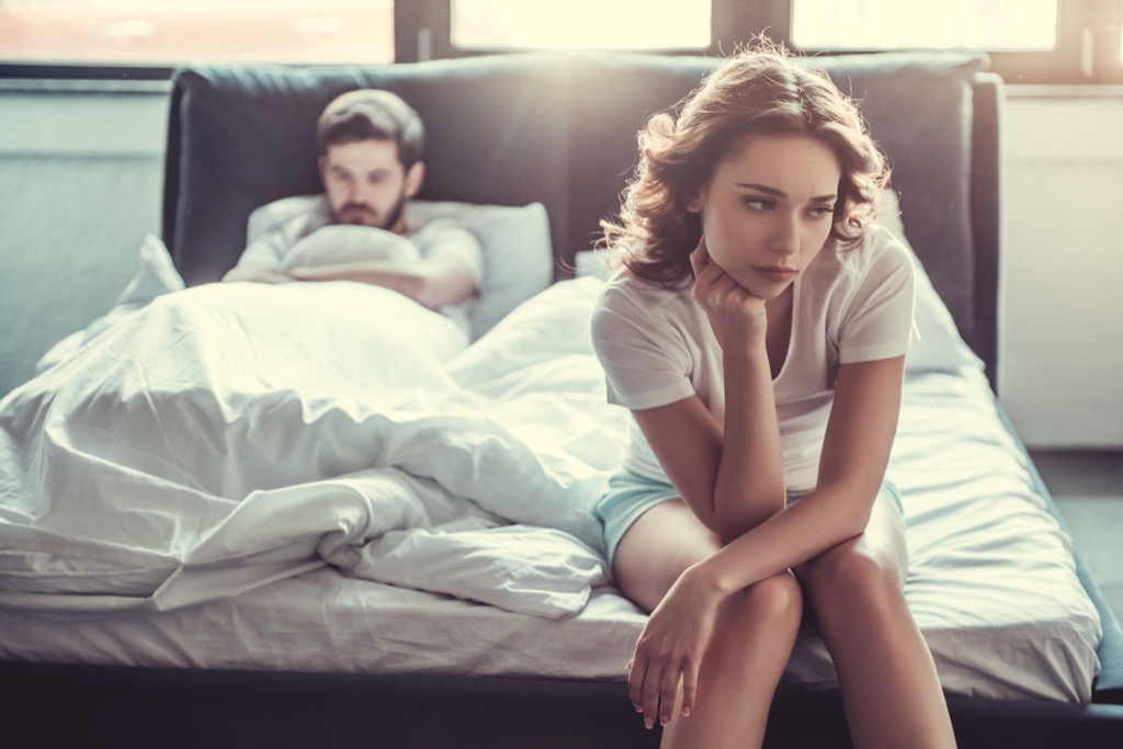 unhappy couple in bed, should i be single.
