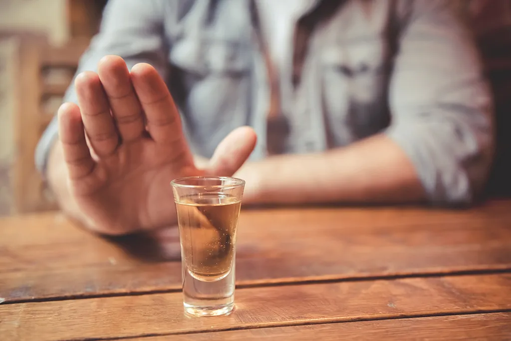 man with alcohol shot