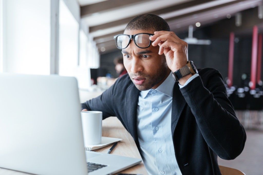 man looking at computer shocked {Groundhog Day is Weird}