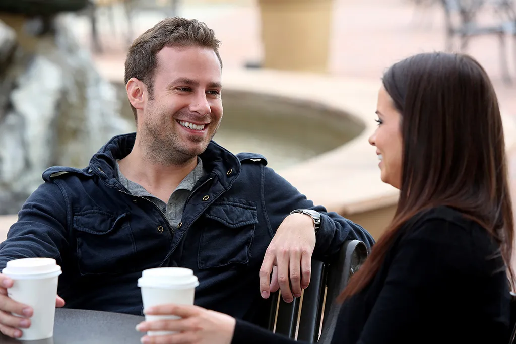 Smiling Couple on Date Reasons Smiling is Good for You