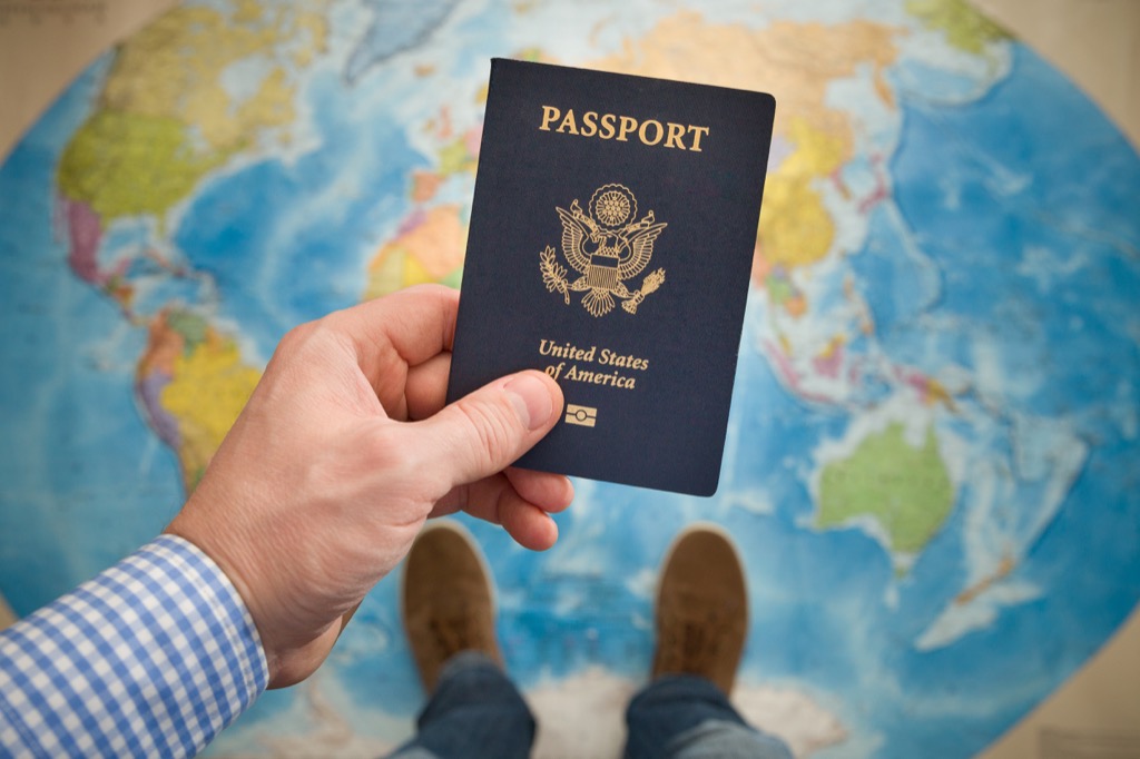 Man holding passport planning trip, healthy sex after 40
